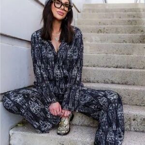 Small Black and White  astronaut Patterned Shirt long sleeve. Dressed in lala